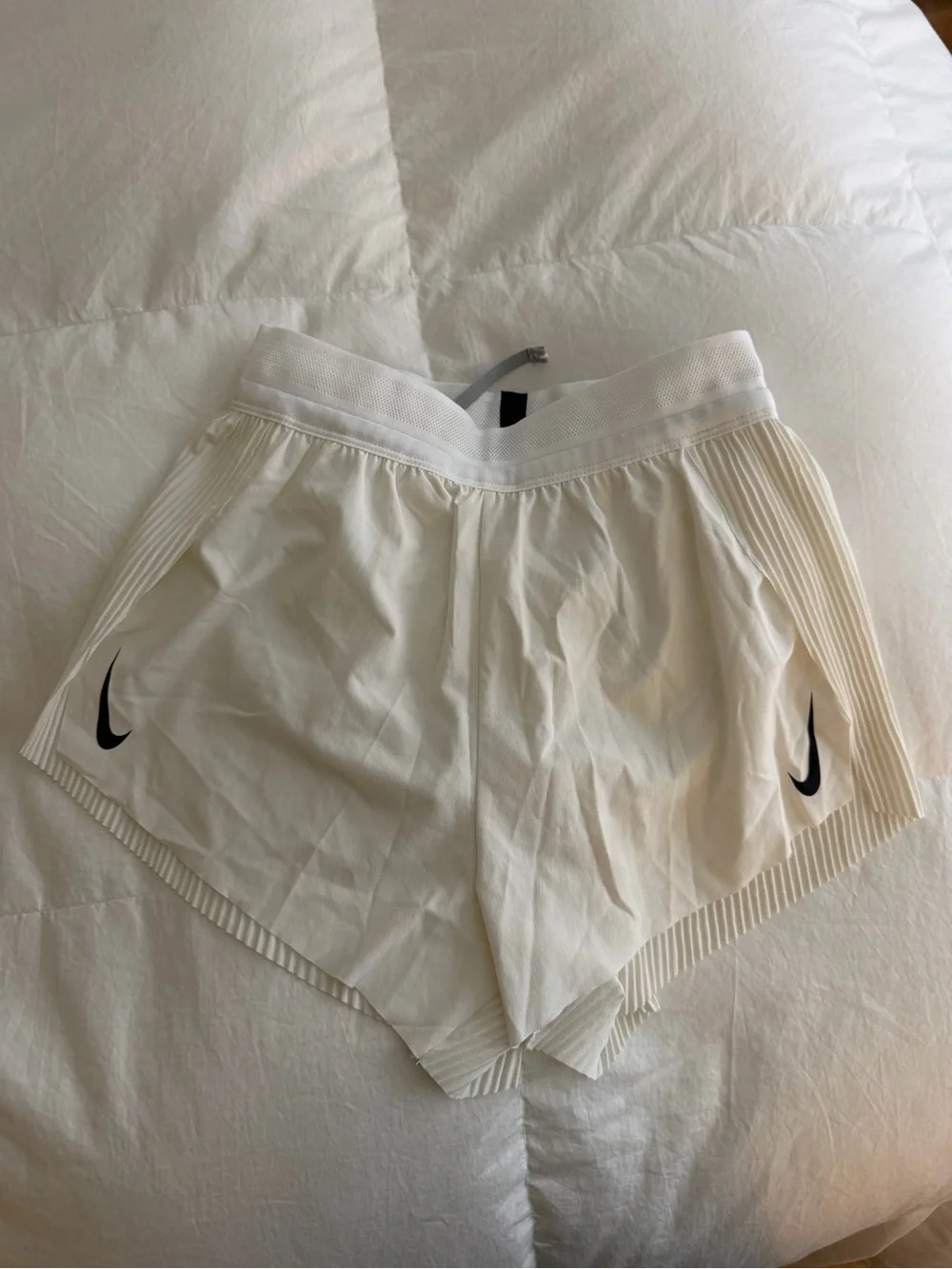 Nike Women's White Athletic Shorts with Black Swoosh